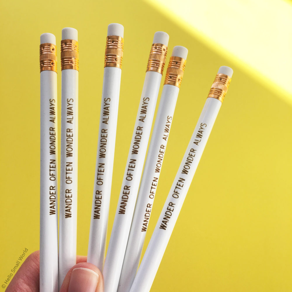 wander often wonder always pencils white with gold on yellow
